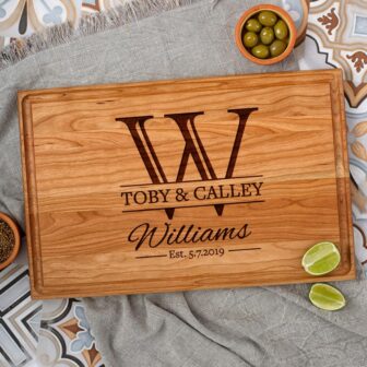 Personalized cutting board with olives and olives.