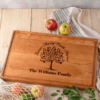 A wooden cutting board with a family tree on it.