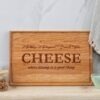 A personalized charcuterie board with cheese on it.