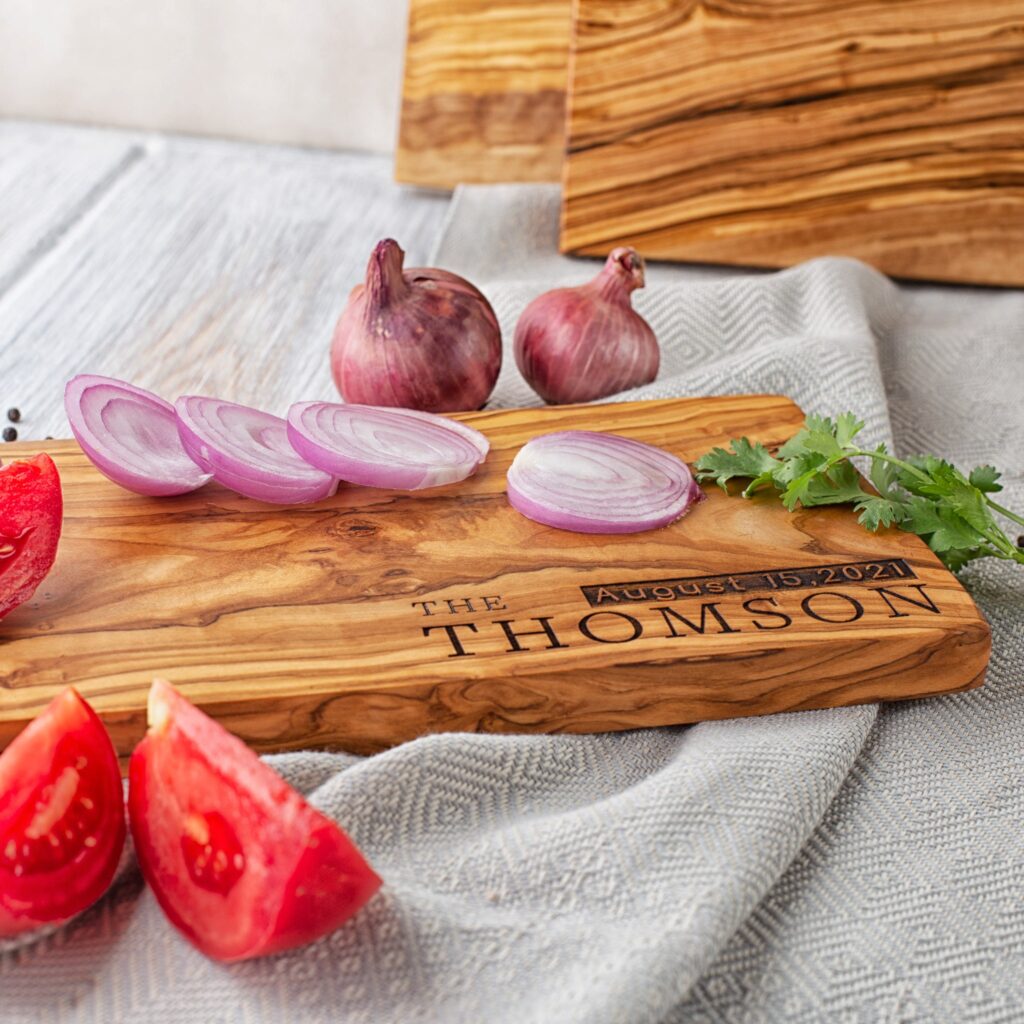 Wooden cutting board with handle and engraving