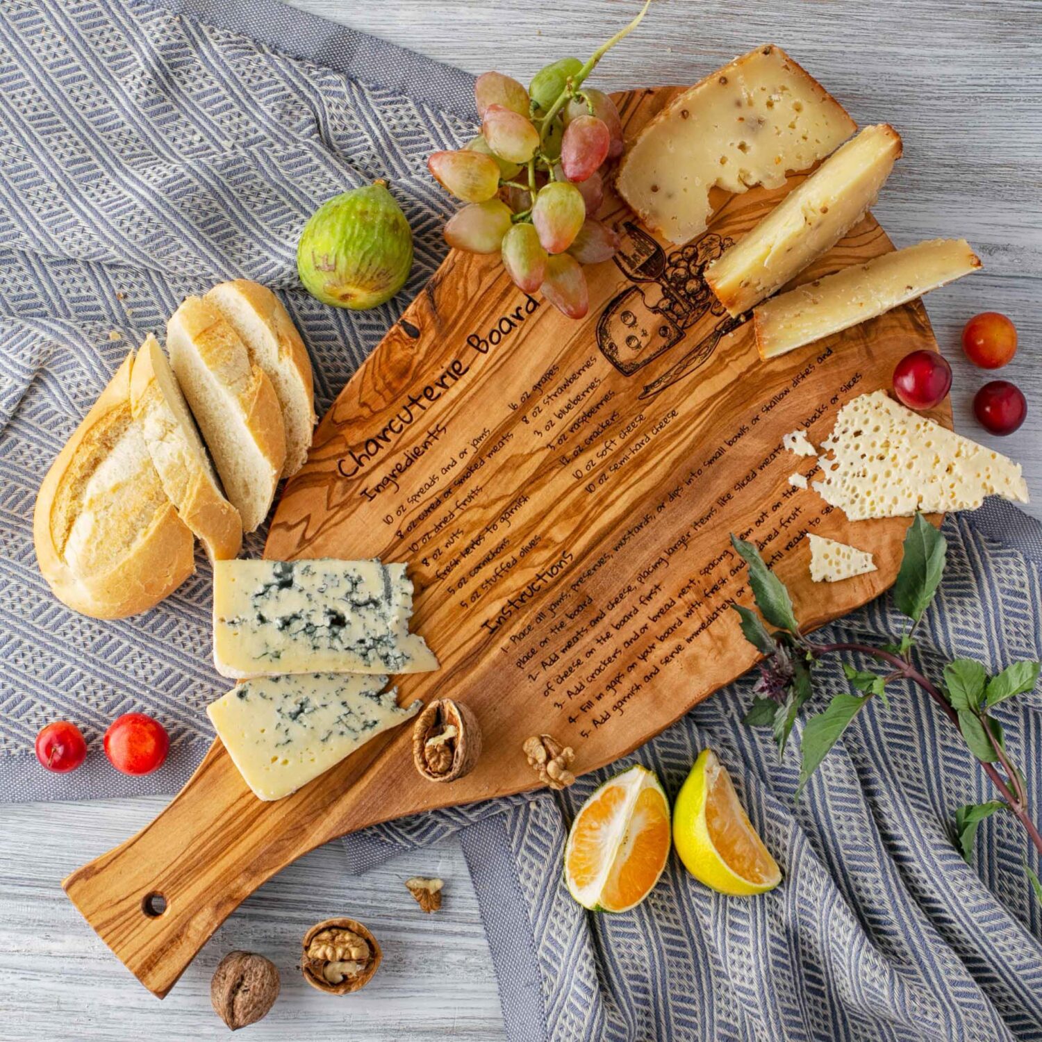 A wooden Serving Charcuterie Board with fruit and cheese on it.
