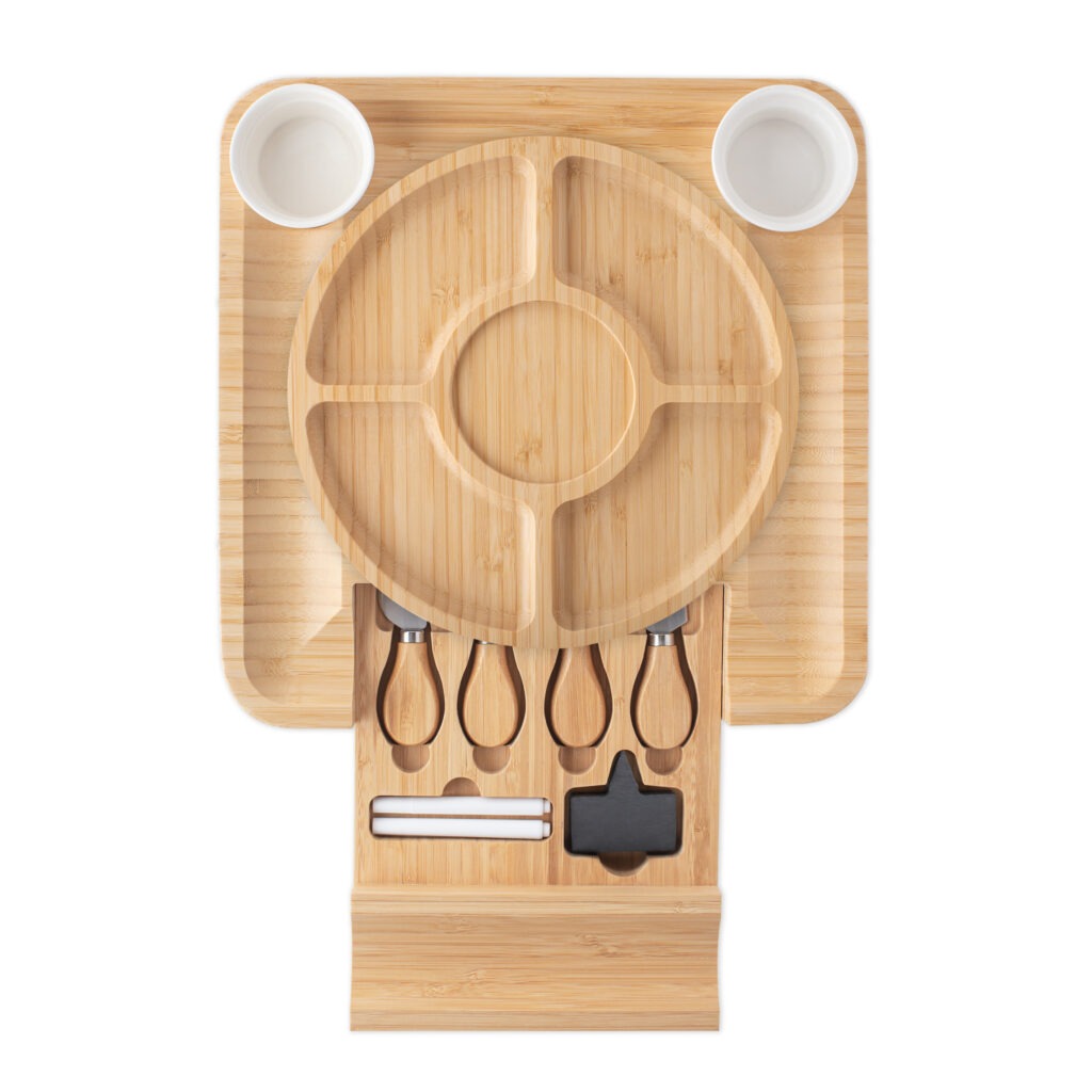 Bamboo cheese board set with slide-out drawer including serving utensils and bowls.