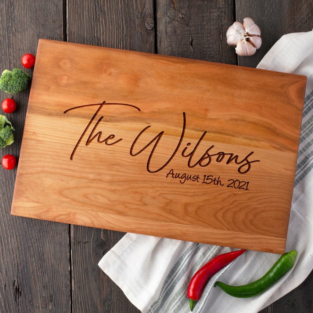 A Custom Engraved Cutting Board with the name the Wilson's on it.