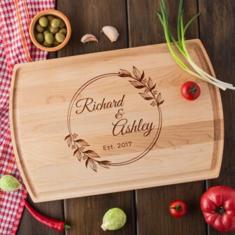 A handmade cutting boards wooden with the name Richard and Alyssa.