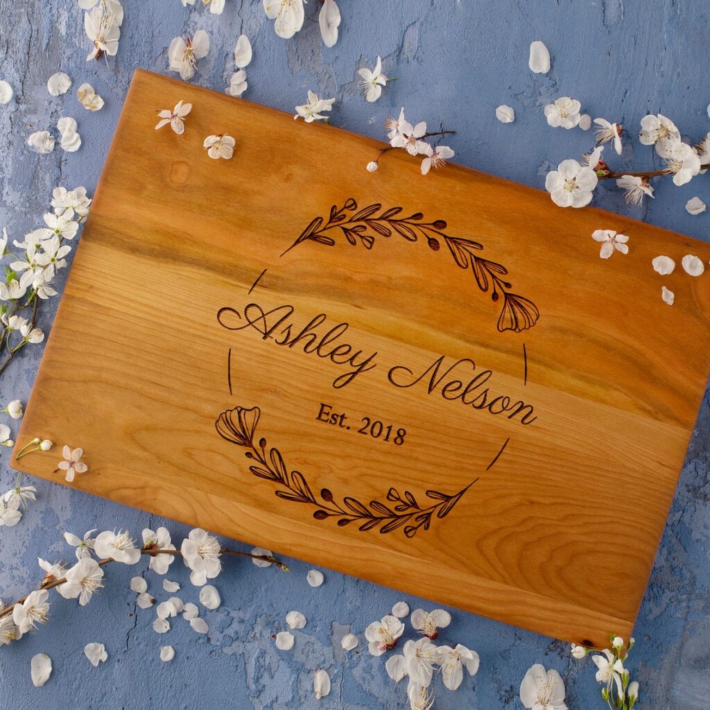 A Personalized Cutting Board with the name Ashley nelson on it.