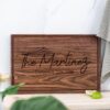 A personalized cutting board with the family name 