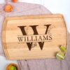 Personalized monogram cutting board with the name on it laying on a table