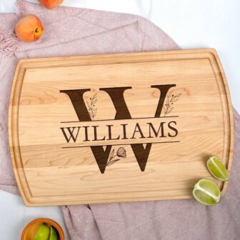 Personalized monogram cutting board with the name Williams on it laying on a table