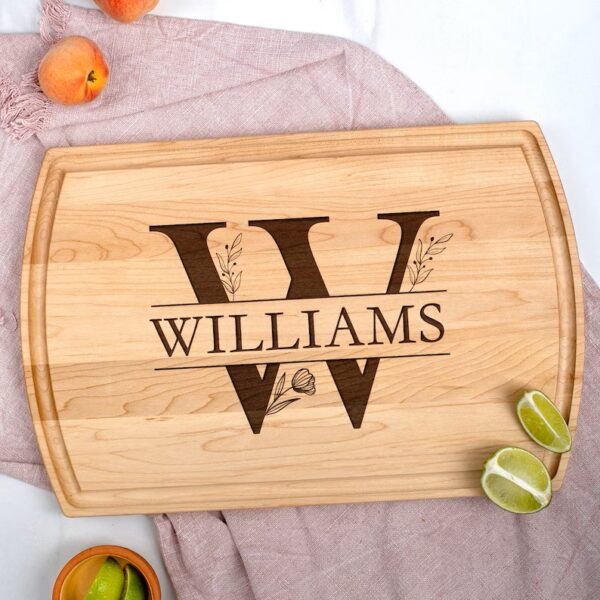 Personalized monogram cutting board with the name on it laying on a table