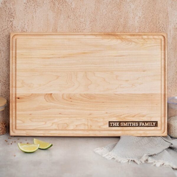 Personalized Wood Cutting Board with the family name on it.