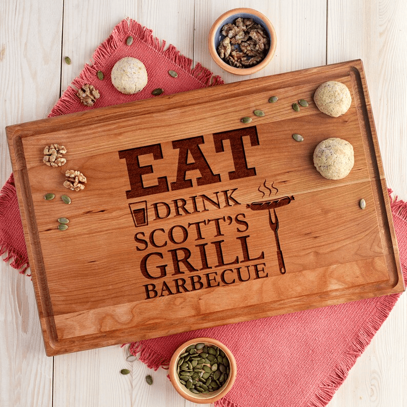 Eat drink scott's grill barbecue cutting board.