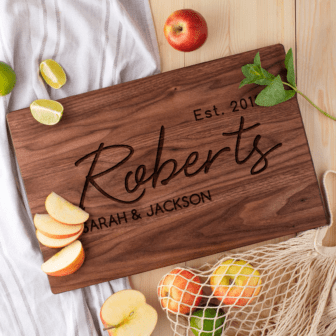 A Personalized Custom Cutting Board with the words Roberts and Jackson.
