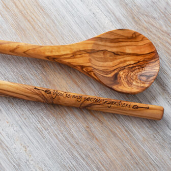 A wooden spoon and a wooden spoon next to each other.