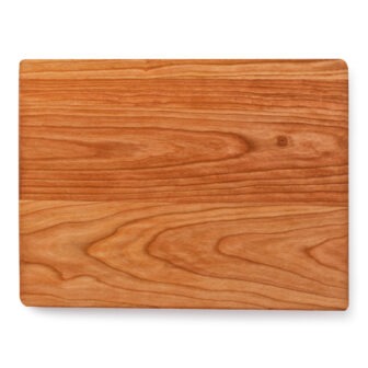 A wooden cutting board on a white background.
