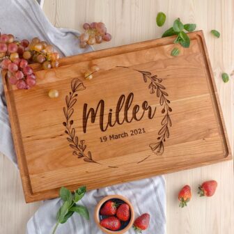 An Engraved Wooden Chopping Board with the name miller on it.