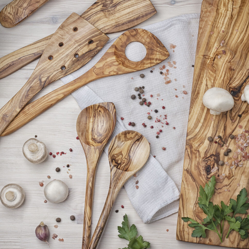 Olive wood utensils and a wooden cutting board.