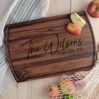 Engraved wooden cutting board with the family name 