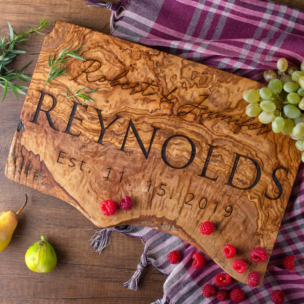 Engraved olive wood charcuterie serving board