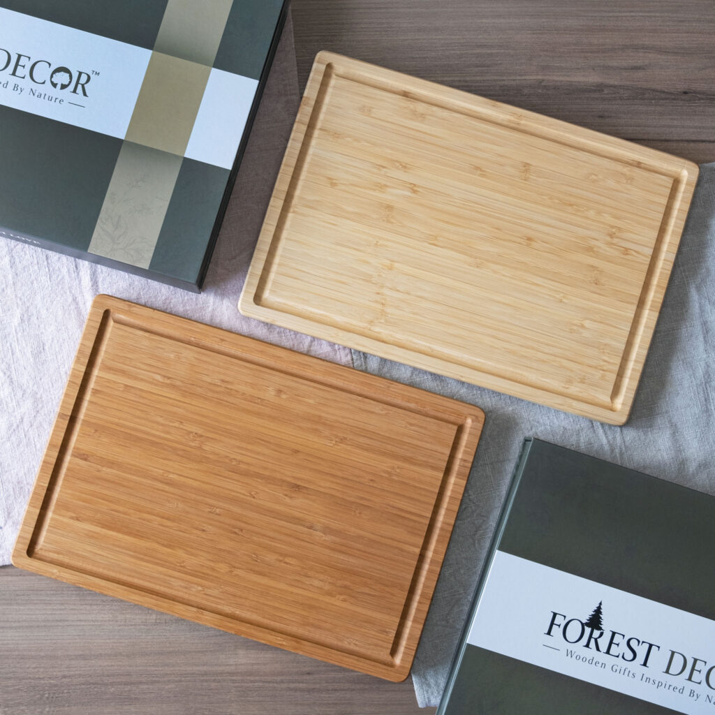 Two rectangular wooden serving trays displayed next to their packaging boxes.