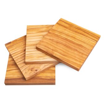 Three overlapping wooden cutting boards isolated on a white background.