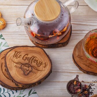 Personalised wooden coasters with tea and teapots.