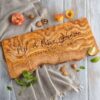 Live edge charcuterie board with engraving of couple's last name and date.