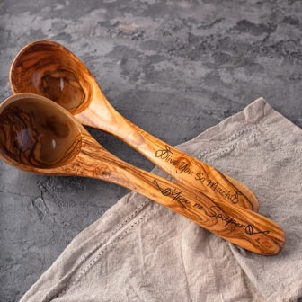 Personalized Wooden Ladle on a piece of cloth.