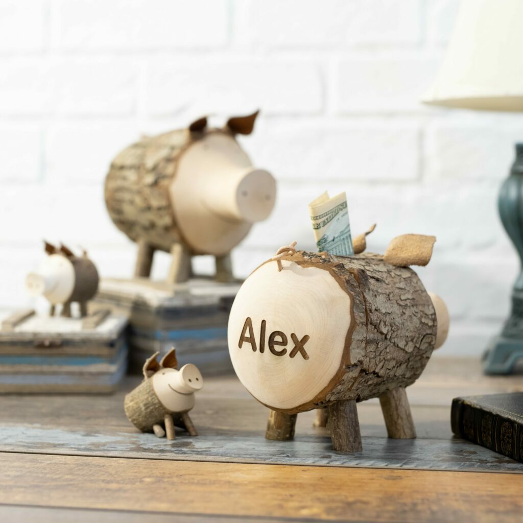 Personalized wooden piggy banks featuring the name Alex.