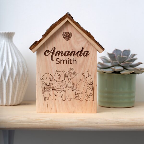 A wooden house with the name amanda smith on it.