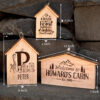 Three wooden signs with the name howard's cabin.
