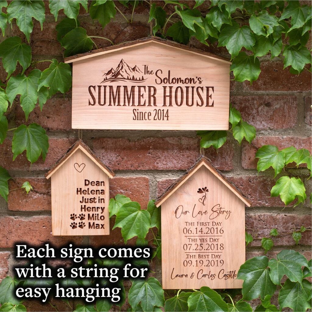 A wooden sign that reads summer house.