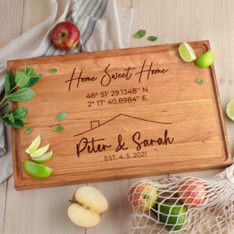 Personalized housewarming cutting board for homeowners.