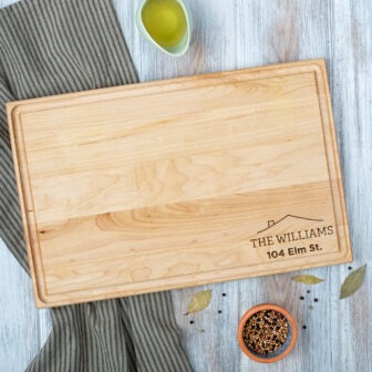 A wooden cutting board with the words the williams family on it.