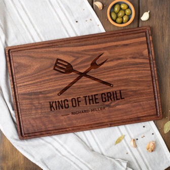 King of the grill personalized cutting board.
