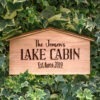 A wooden sign that says the jennifer's lake cabin.