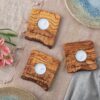 three personalized candle holders as rustic wedding table decor