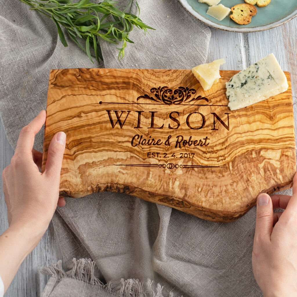 A wooden cutting board with the name wilson on it.