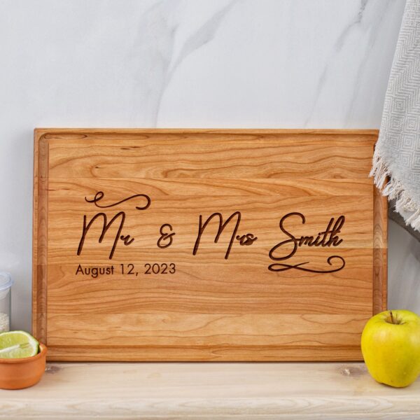 A wooden cutting board with the words mr and mrs smith.