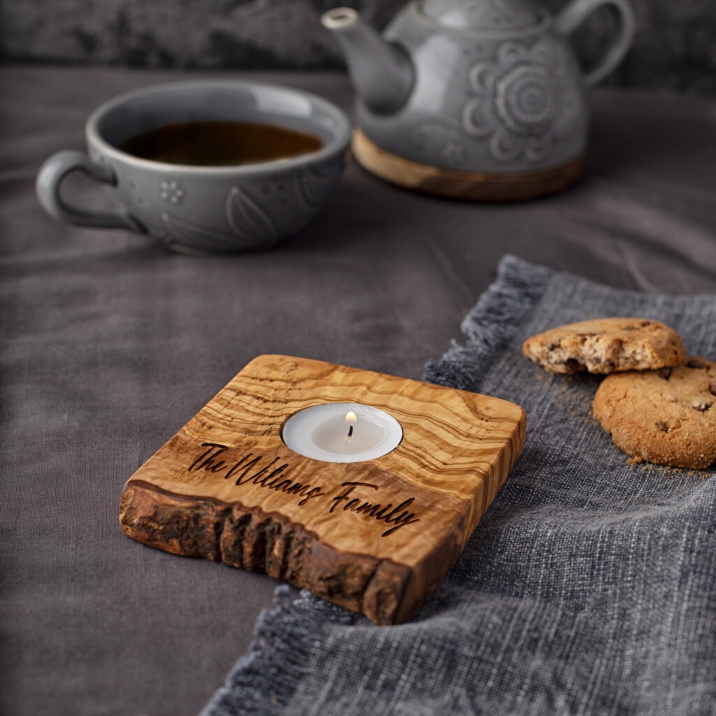 A wooden tea light holder with engraving