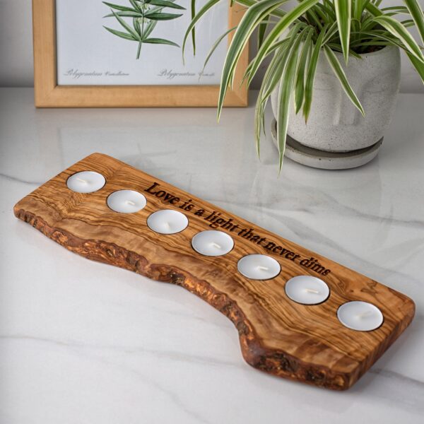 a live edge candle holder with seven tealight candles.