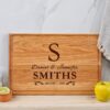 A cutting board with the initial s on it.