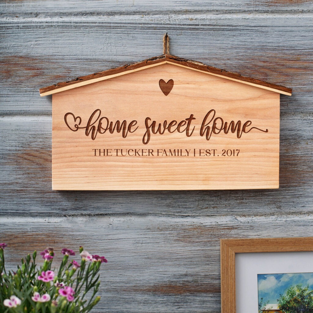 A wooden sign that reads home sweet home.