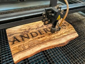 A piece of wood with the word Andersons engraved on it.