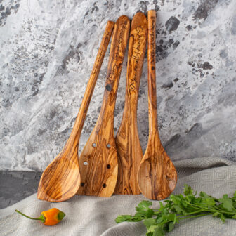 A set of wooden spoons on a table.