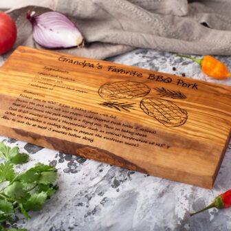 An Olive Wood Recipe Cutting Board with a recipe for BBQ ribs.