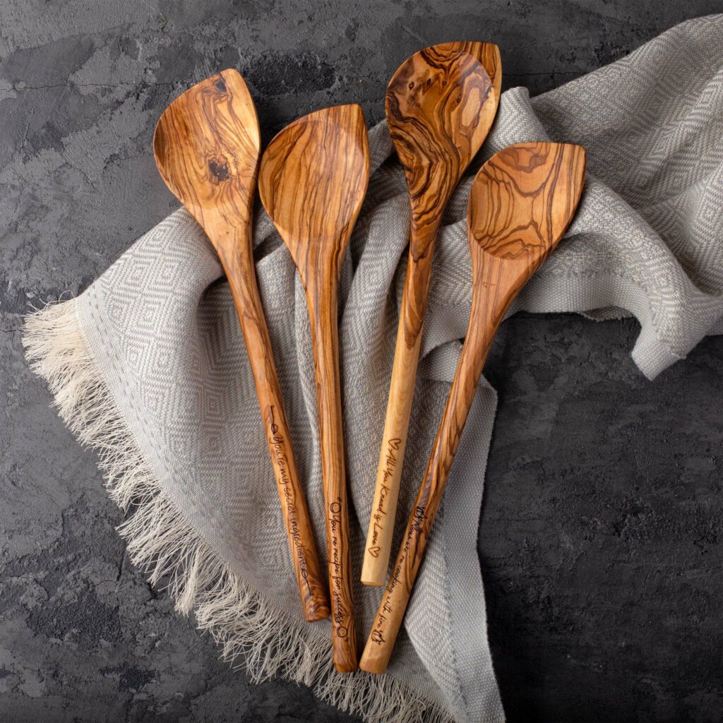 Olive Wood Spoons (Corner) on a blanket.