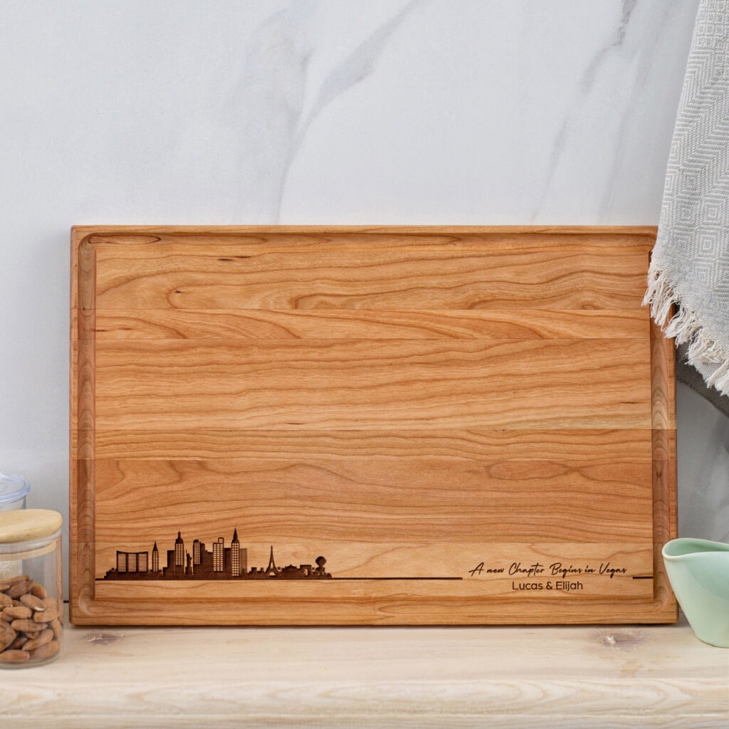 A wooden cutting board with a city skyline on it.