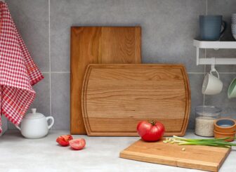 A wooden cutting board on a kitchen counter.