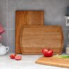 three wooden cutting board on a kitchen counter.
