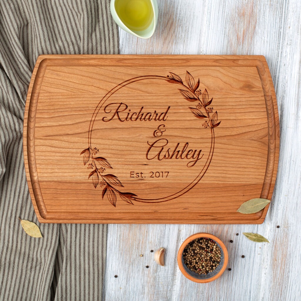 A wooden cutting board with the words richard and adelaide on it.